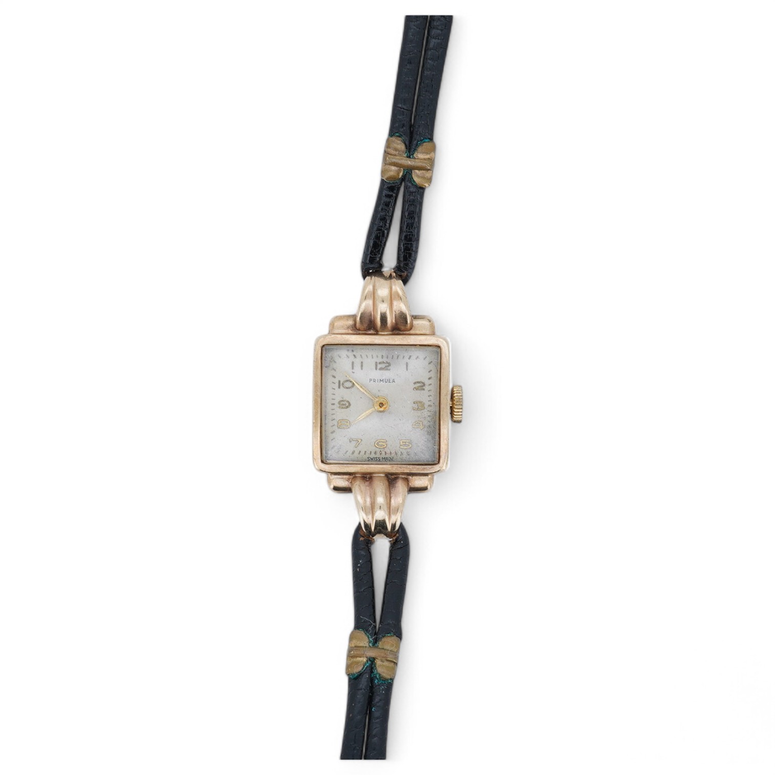 A lady's 9ct gold Primula manual wind wrist watch, with fluted lugs, on a leather strap. Condition - fair